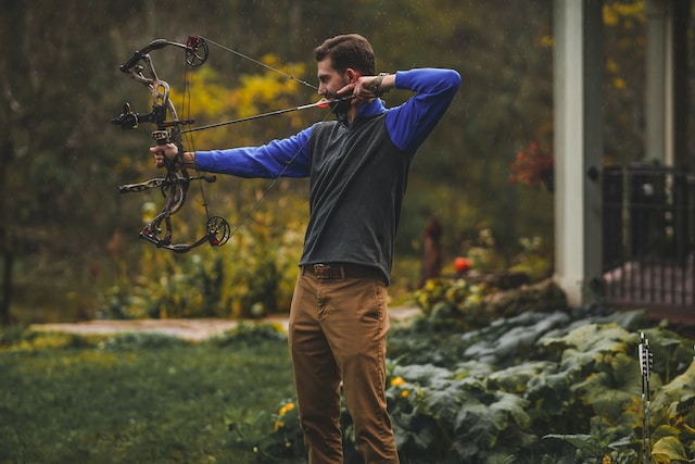 man with compound bow